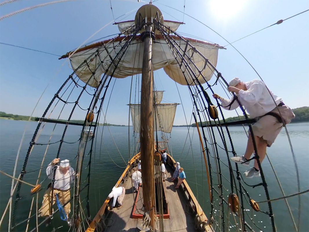 A 360 image of a ship on a body of water.